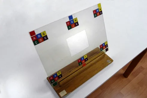 Photo: Alphabet board in E-Tran format, with position and colour coding; the colour code is available in downloads